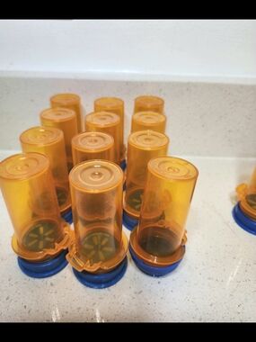 Set of 16 Amber Plastic Pill Bottles with Blue Caps 2 Sizes Empty.